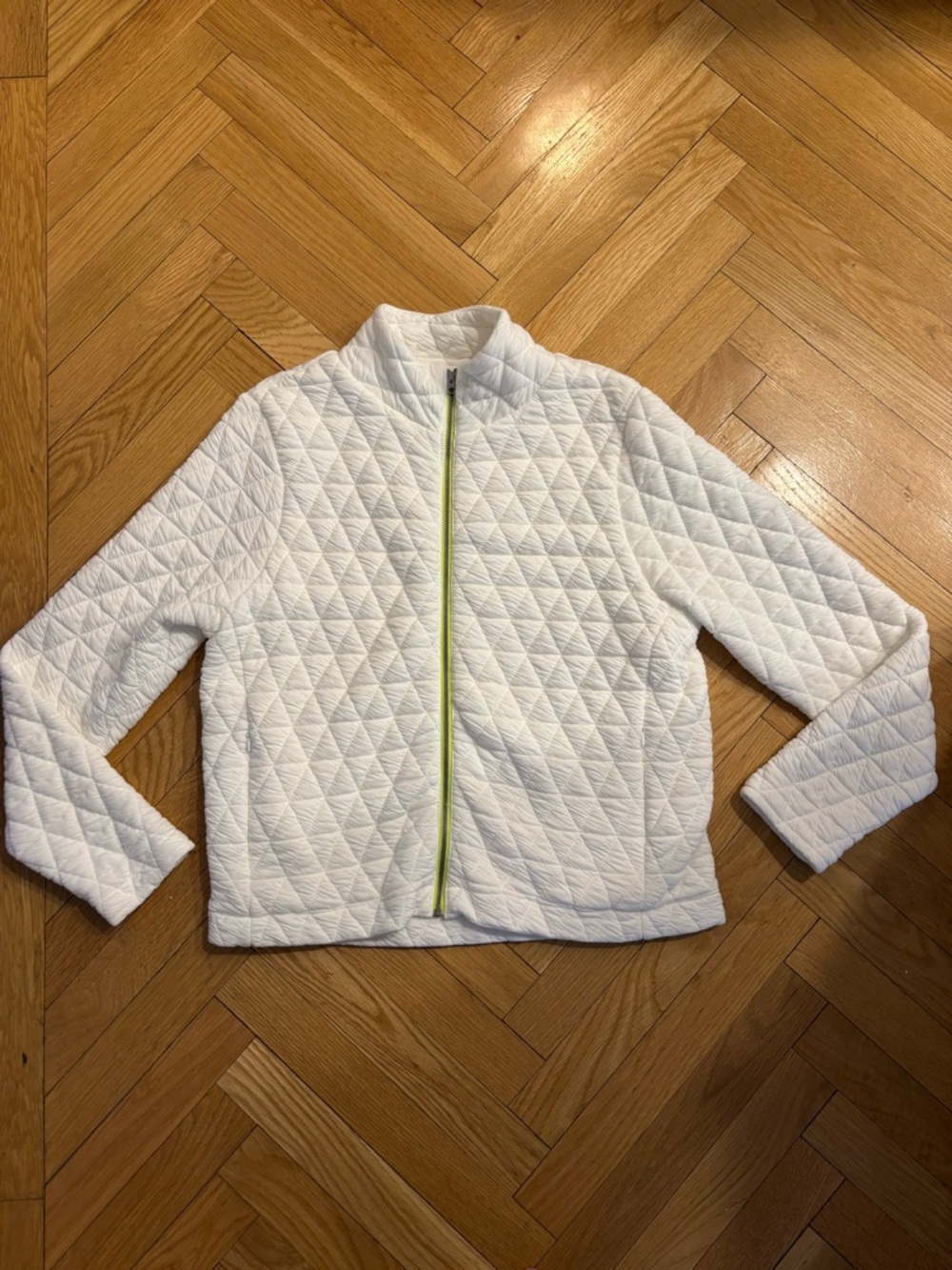 Hello Nite Los Angeles white quilted jacket with neon yellow trim at zipper